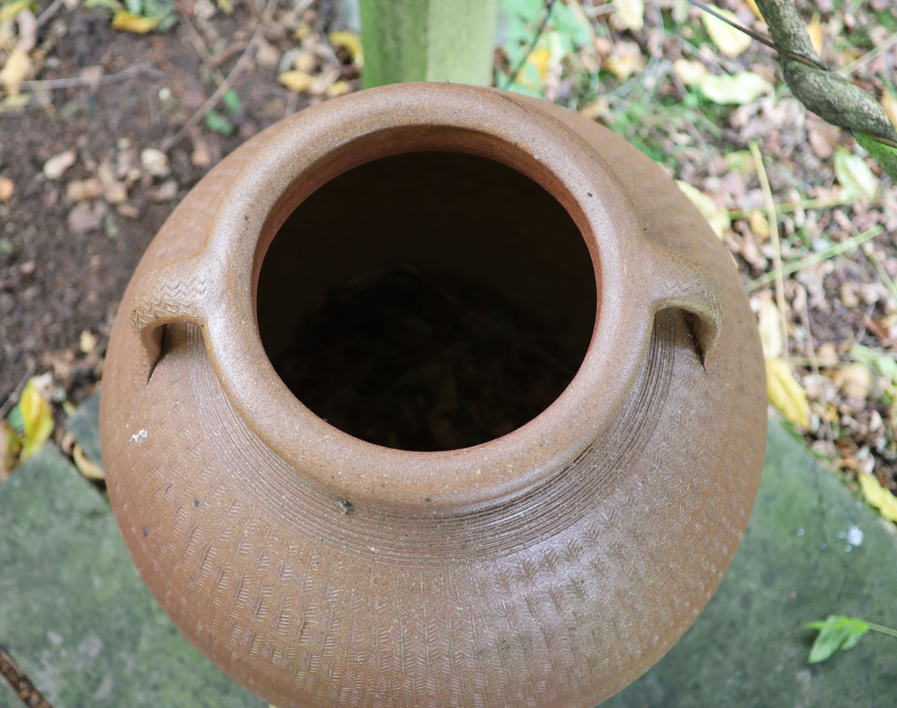 A two handled terracotta garden urn, height 73cm